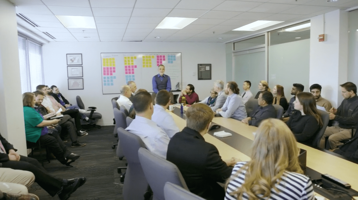 tesla-conference-room-group-shot Tesla conference room full of the Tesla team